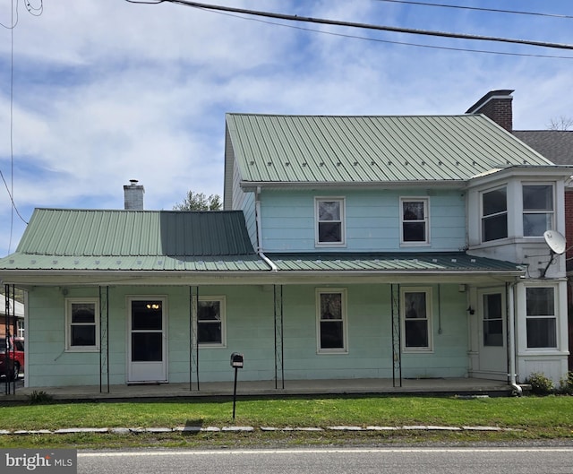 13177 Main St, Fort Loudon, PA 17224 - farmhouse inspired home with a porch, a chimney, and metal roof