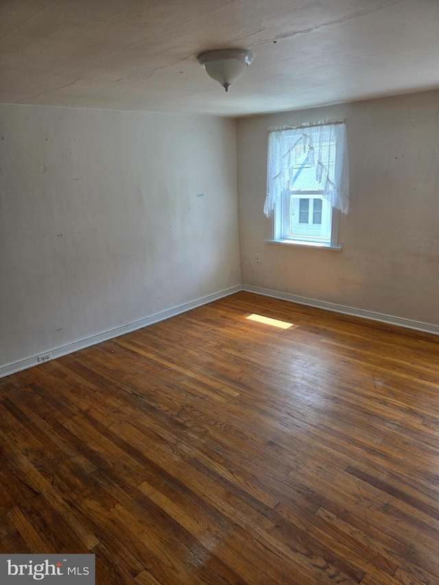 13177 Main St, Fort Loudon, PA 17224 - unfurnished room with baseboards and dark wood-style flooring