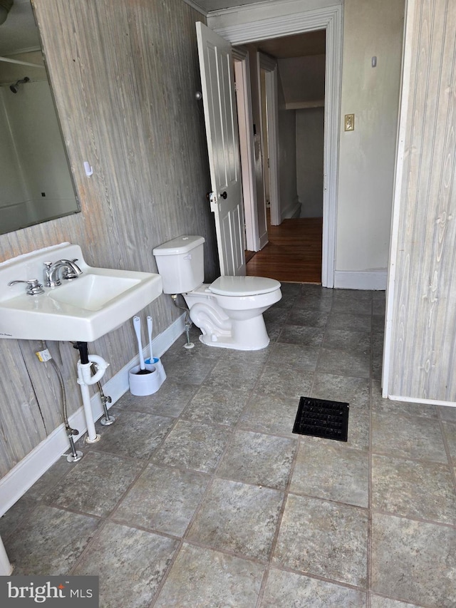 13177 Main St, Fort Loudon, PA 17224 - bathroom featuring baseboards, wood walls, and toilet