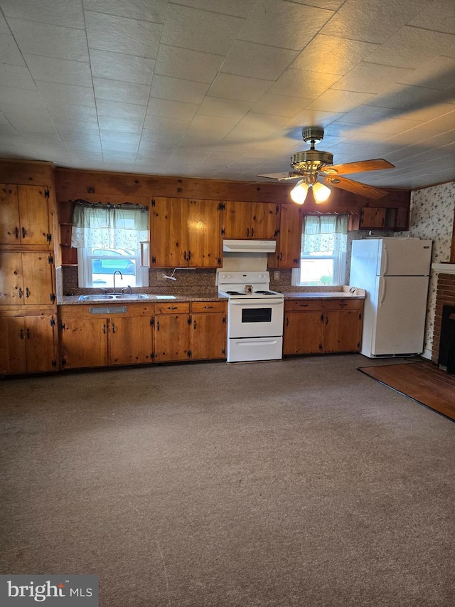 13177 Main St, Fort Loudon, PA 17224 - kitchen with white appliances, a ceiling fan, under cabinet range hood, and brown cabinetry