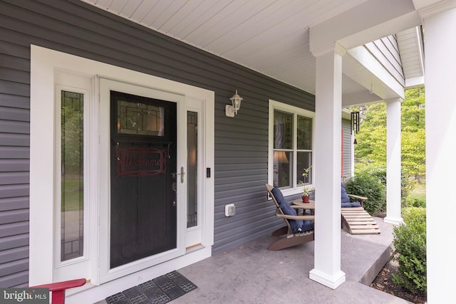 property entrance with covered porch