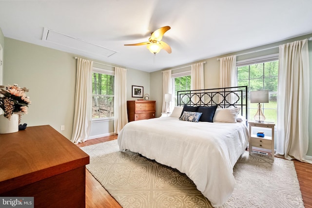 33 Fern Ct, Front Royal, VA 22630 - bedroom featuring attic access, wood finished floors, and a ceiling fan