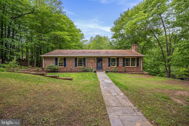 33 Fern Ct, Front Royal, VA 22630 - view of front of house with a front lawn, brick siding, and a chimney