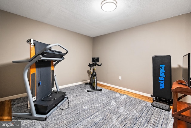 33 Fern Ct, Front Royal, VA 22630 - workout area with baseboards and wood finished floors