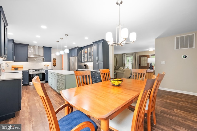 33 Fern Ct, Front Royal, VA 22630 - dining room featuring wood finished floors, a chandelier, recessed lighting, and baseboards