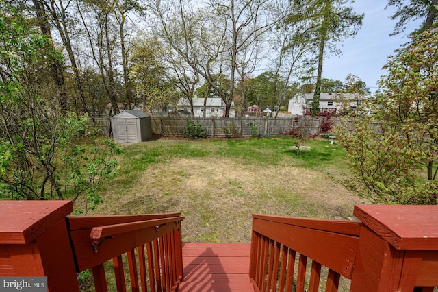 206 Iriquois, Browns Mills, NJ 08015 - view of yard with a fenced backyard, an outbuilding, a storage shed, and a deck