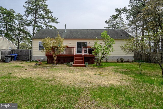 206 Iriquois, Browns Mills, NJ 08015 - back of house featuring roof with shingles, a lawn, a deck, a gate, and fence