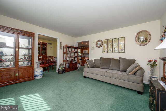206 Iriquois, Browns Mills, NJ 08015 - living area featuring carpet floors, a chandelier, and visible vents