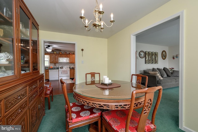 206 Iriquois, Browns Mills, NJ 08015 - dining space with a notable chandelier and dark carpet