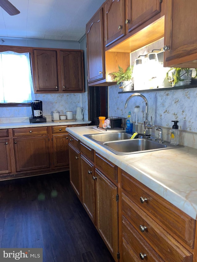 451 Main St, Ashland, PA 17921 - kitchen with a sink, light countertops, dark wood finished floors, decorative backsplash, and brown cabinets