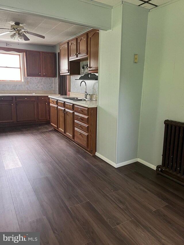 451 Main St, Ashland, PA 17921 - kitchen with light countertops, radiator, dark wood finished floors, and a ceiling fan