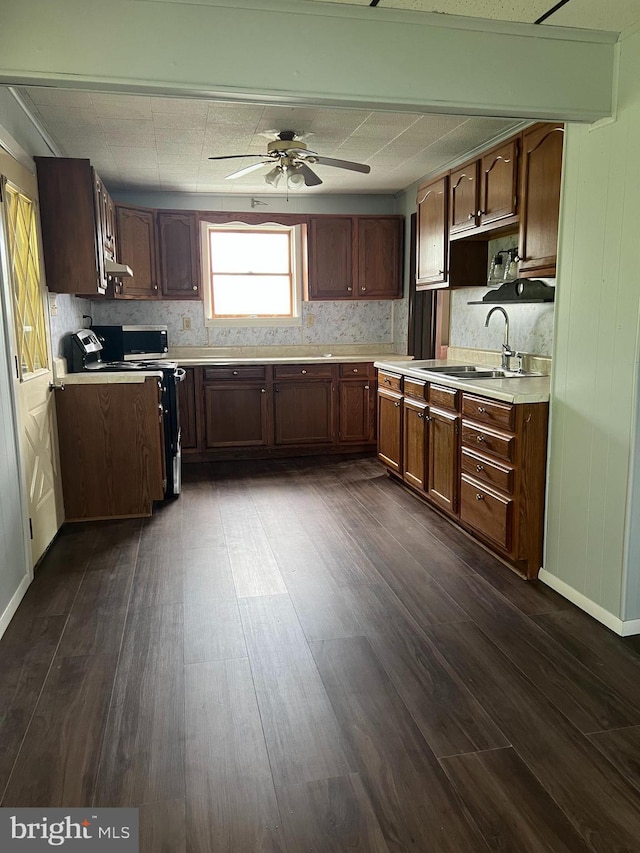 451 Main St, Ashland, PA 17921 - kitchen with range with electric cooktop, a sink, light countertops, ceiling fan, and dark wood-style flooring