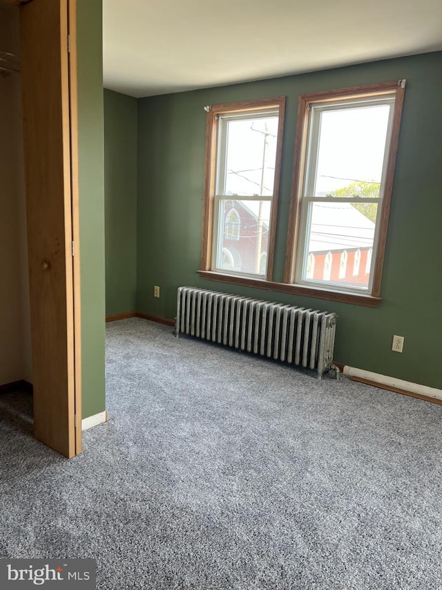 451 Main St, Ashland, PA 17921 - unfurnished bedroom with radiator heating unit, carpet floors, and baseboards