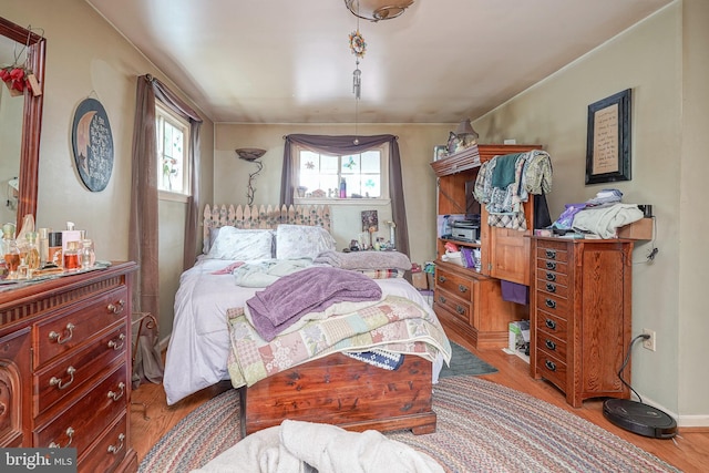 bedroom featuring wood finished floors