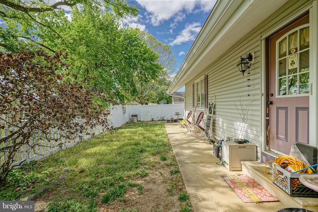 view of yard with a patio and a fenced backyard