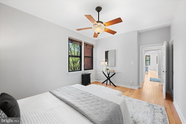 4007 Connecticut Ave NW Unit 302, Washington, DC 20008 - bedroom with arched walkways, light wood-style flooring, baseboards, and ceiling fan