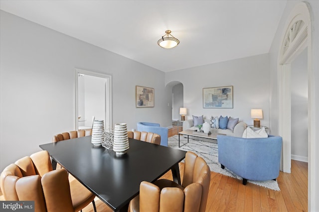 4007 Connecticut Ave NW Unit 302, Washington, DC 20008 - dining area featuring arched walkways and light wood-style flooring