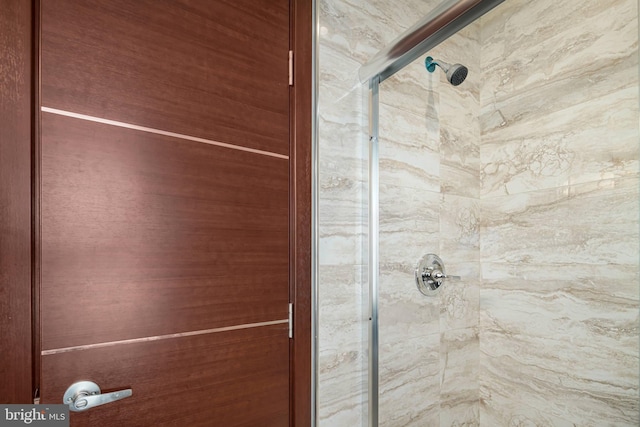 bathroom with tiled shower