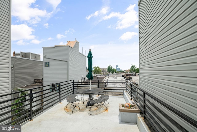 view of patio featuring a balcony
