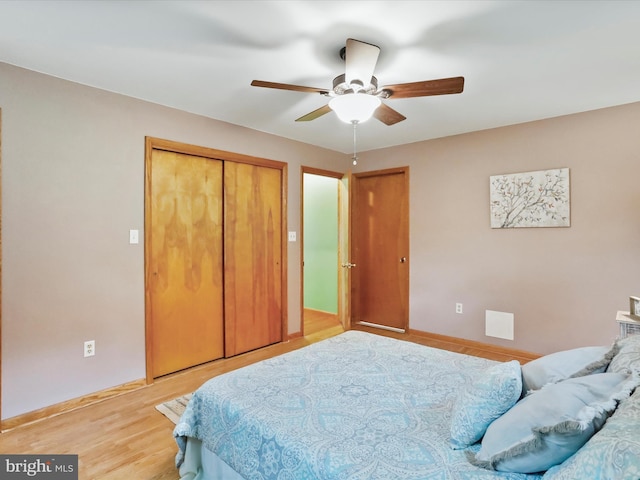 11416 Kline Dr NW, Cumberland, MD 21502 - bedroom with a closet, baseboards, light wood finished floors, and a ceiling fan