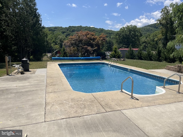 11416 Kline Dr NW, Cumberland, MD 21502 - view of swimming pool with a patio, a covered pool, and a forest view