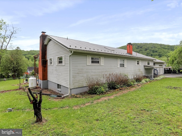 11416 Kline Dr NW, Cumberland, MD 21502 - view of side of home with a chimney and metal roof
