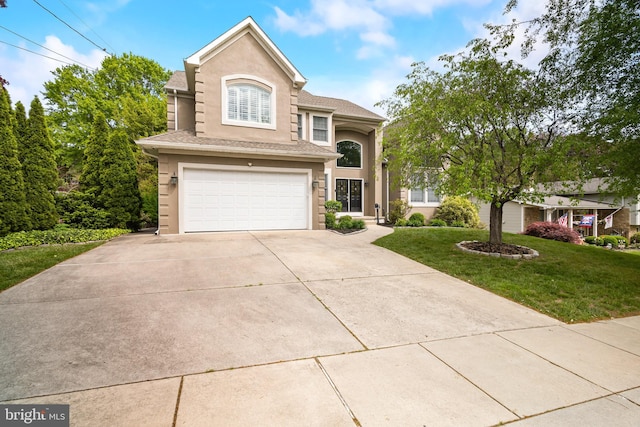 137 E Holly, Haddon Township, NJ 08107 - traditional-style house featuring stucco siding, an attached garage, a front lawn, and concrete driveway