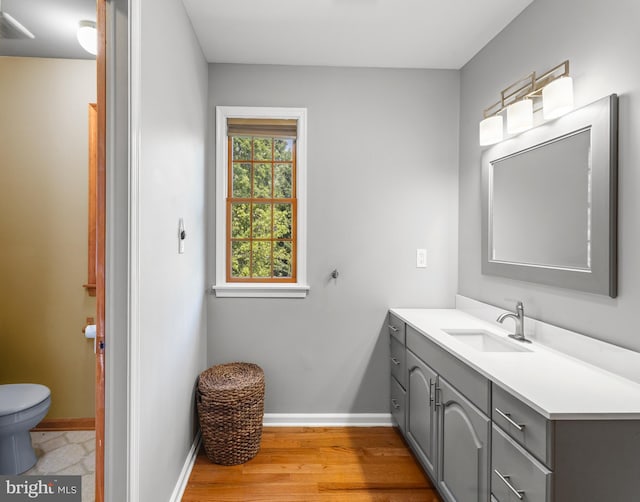 137 E Holly, Haddon Township, NJ 08107 - bathroom featuring toilet, vanity, baseboards, and wood finished floors