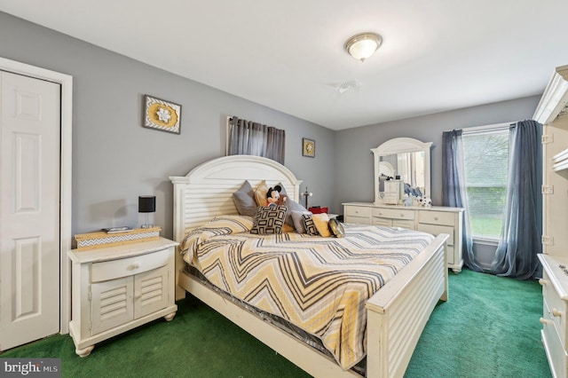 bedroom with dark carpet