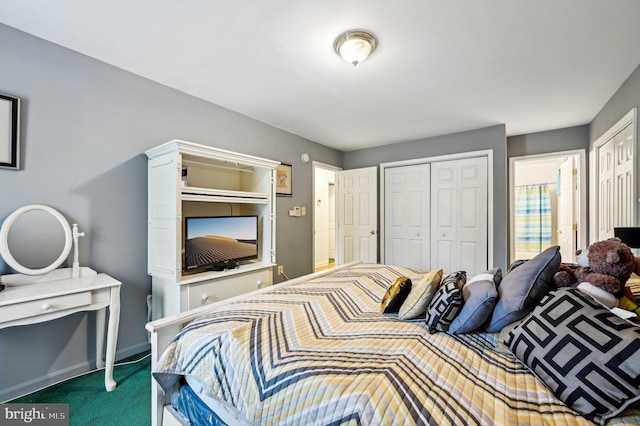 carpeted bedroom with baseboards