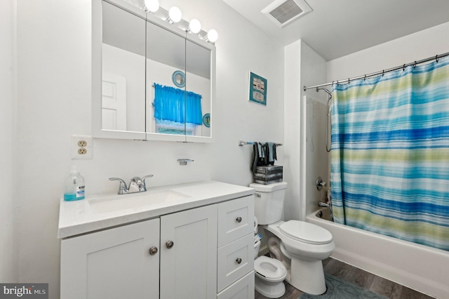 full bathroom with toilet, shower / bath combo with shower curtain, vanity, and wood finished floors