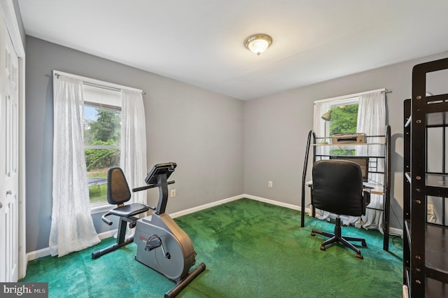 carpeted office space with baseboards