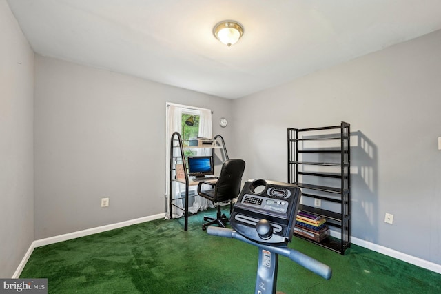 exercise room with carpet flooring and baseboards