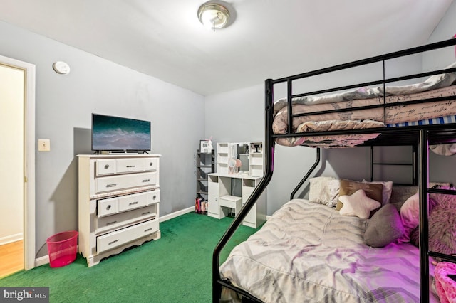 carpeted bedroom with baseboards
