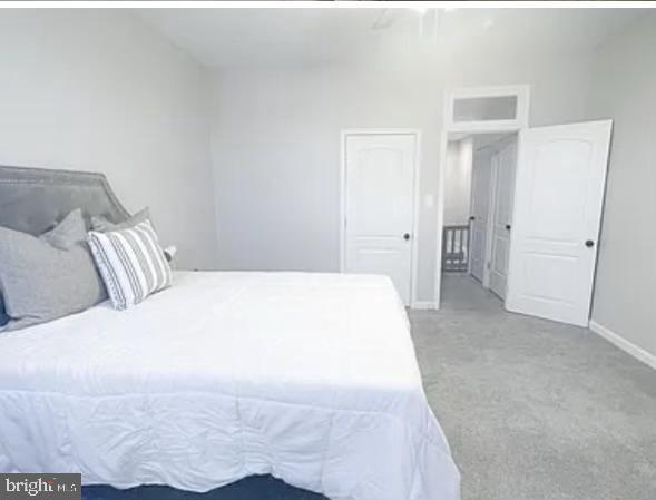 2919 Arunah Ave, Baltimore, MD 21216 - carpeted bedroom featuring baseboards