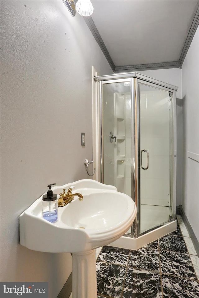 7395 Jonestown Rd, Harrisburg, PA 17112 - bathroom with crown molding, a shower stall, a sink, and marble finish floor