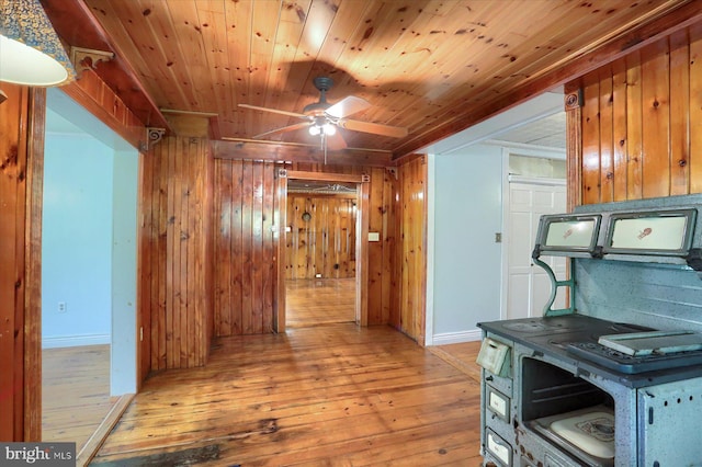 7395 Jonestown Rd, Harrisburg, PA 17112 - hall featuring wood walls, baseboards, and light wood-type flooring