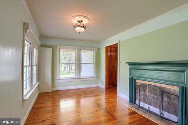 7395 Jonestown Rd, Harrisburg, PA 17112 - unfurnished living room featuring a fireplace with flush hearth, hardwood / wood-style floors, and a healthy amount of sunlight
