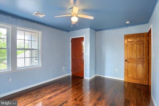 7395 Jonestown Rd, Harrisburg, PA 17112 - unfurnished bedroom featuring baseboards, visible vents, multiple windows, and dark wood finished floors