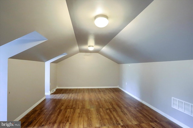 7395 Jonestown Rd, Harrisburg, PA 17112 - additional living space with visible vents, baseboards, wood finished floors, and vaulted ceiling