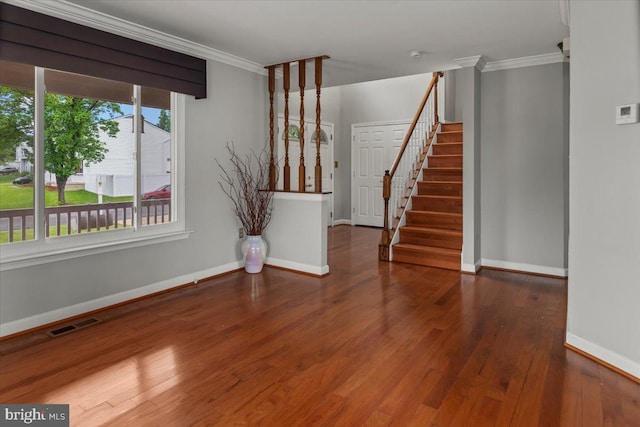 12401 Trotter Ter, Upper Marlboro, MD 20774 - empty room featuring baseboards, wood finished floors, crown molding, and stairway