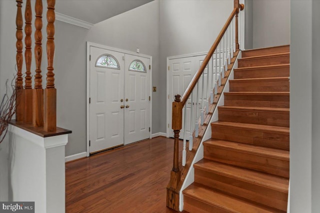 12401 Trotter Ter, Upper Marlboro, MD 20774 - entryway featuring stairway, wood finished floors, ornamental molding, and baseboards