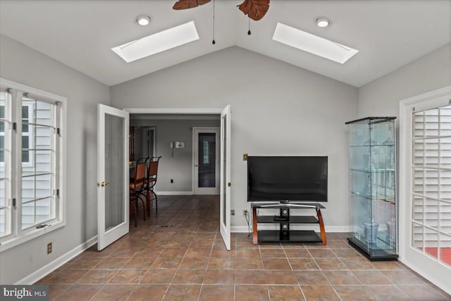 12401 Trotter Ter, Upper Marlboro, MD 20774 - tiled living room featuring a skylight, vaulted ceiling, baseboards, and recessed lighting