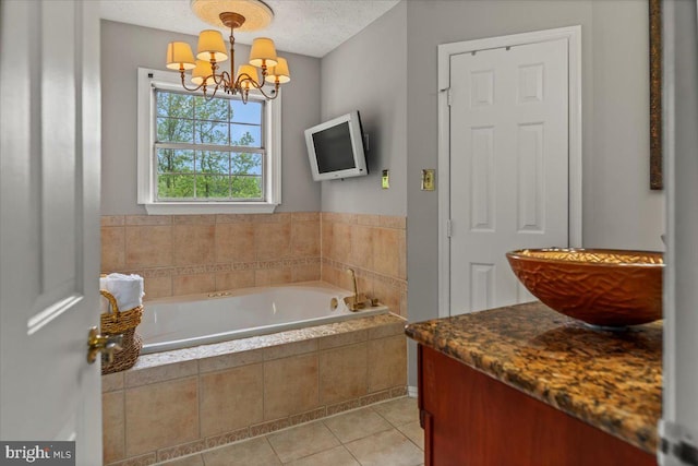 12401 Trotter Ter, Upper Marlboro, MD 20774 - bathroom featuring a chandelier, tile patterned flooring, a garden tub, and vanity