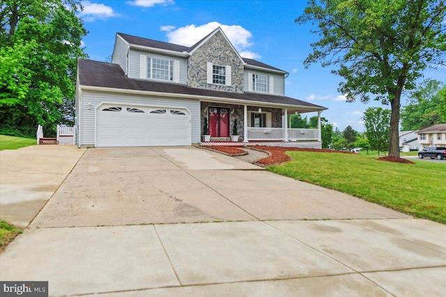 12401 Trotter Ter, Upper Marlboro, MD 20774 - traditional home with a porch, driveway, a front lawn, stone siding, and an attached garage