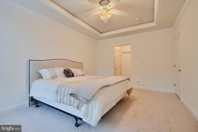 bedroom with light carpet, baseboards, ceiling fan, crown molding, and a raised ceiling