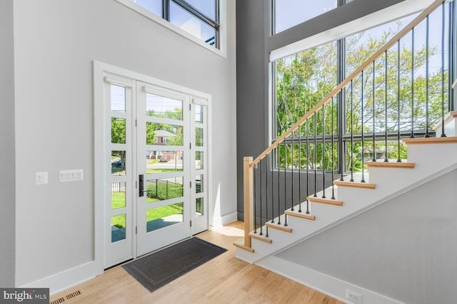2600 3rd St N, Arlington, VA 22201 - entryway featuring stairway, baseboards, wood finished floors, and visible vents