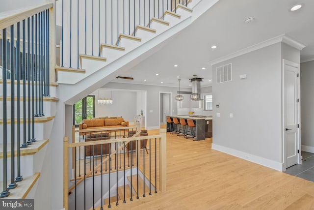 2600 3rd St N, Arlington, VA 22201 - staircase featuring crown molding, baseboards, wood finished floors, and visible vents