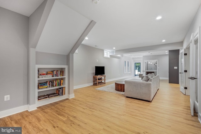 2600 3rd St N, Arlington, VA 22201 - living room featuring built in shelves, baseboards, recessed lighting, and light wood-style flooring