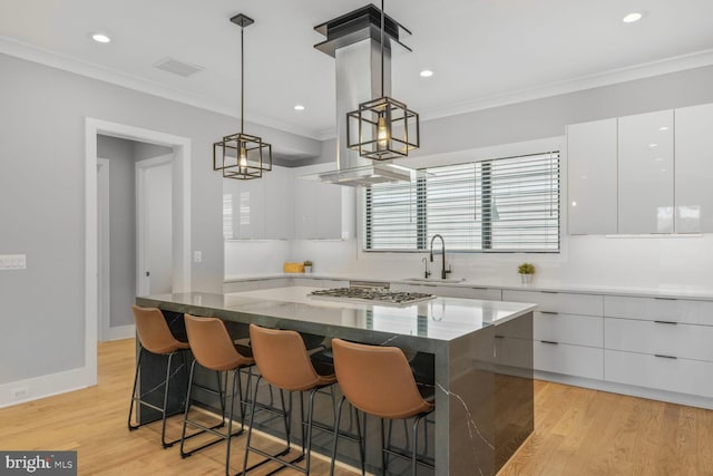2600 3rd St N, Arlington, VA 22201 - kitchen featuring a sink, stainless steel gas cooktop, white cabinetry, visible vents, and modern cabinets